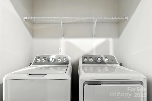 a view of an empty room with racks on the wall