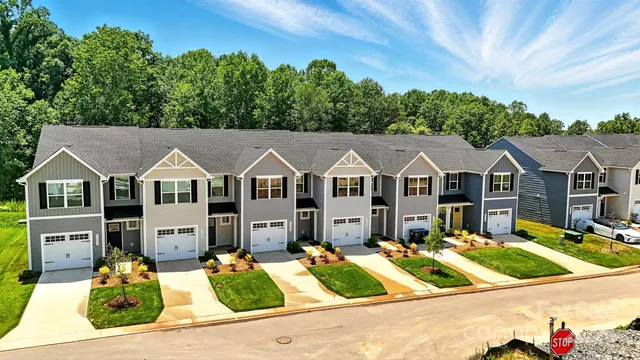 a view of a house with potted plants