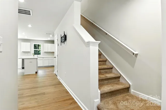 a kitchen with a refrigerator and a sink