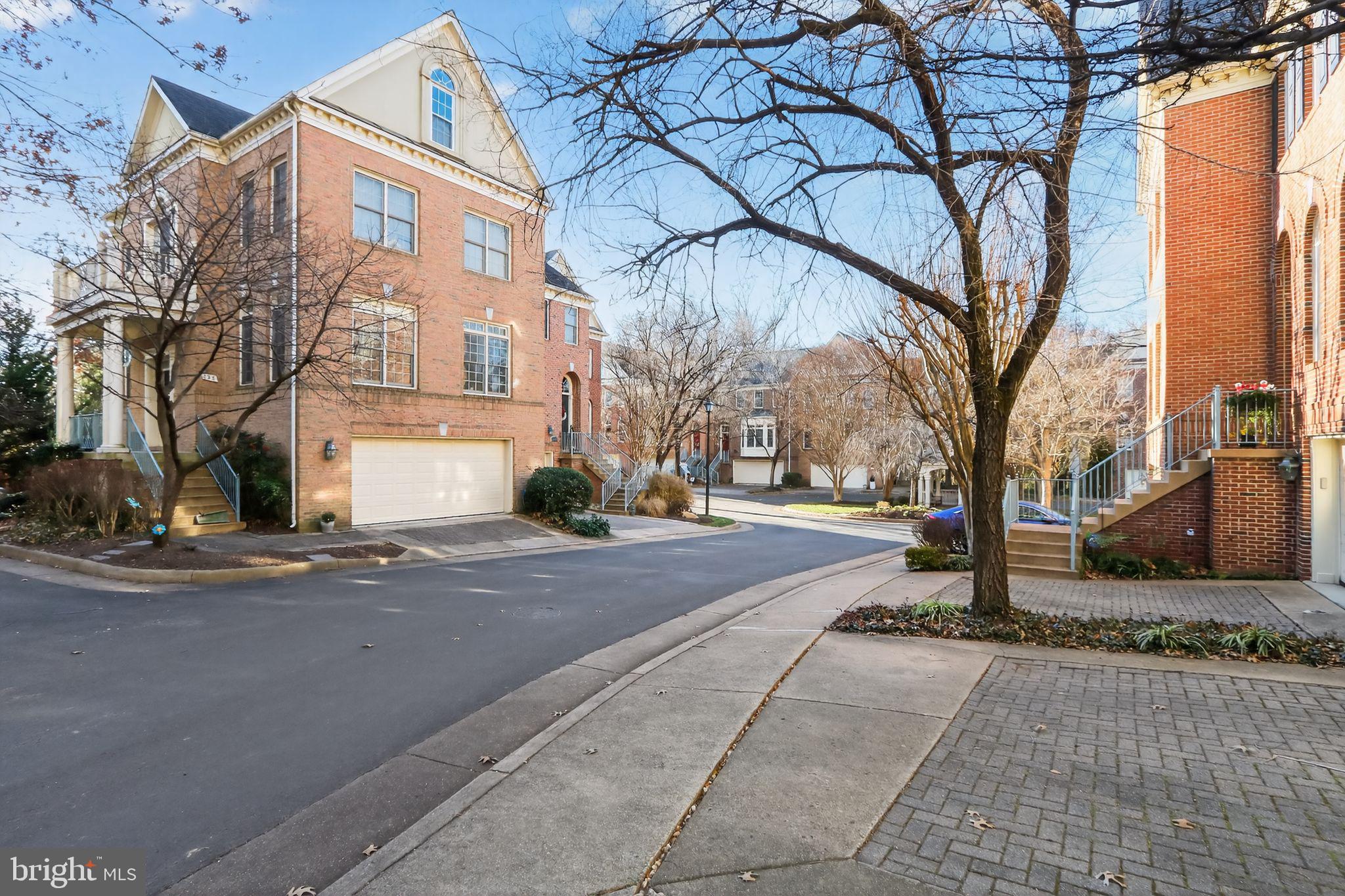 128 Rees Place Falls Church, VA 22046 - Photo 15 of 29 a street sign on a sidewalk next to a road