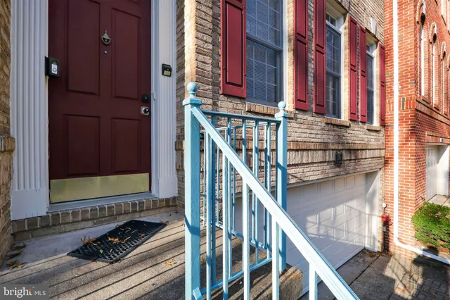 a view of front door of house with stairs