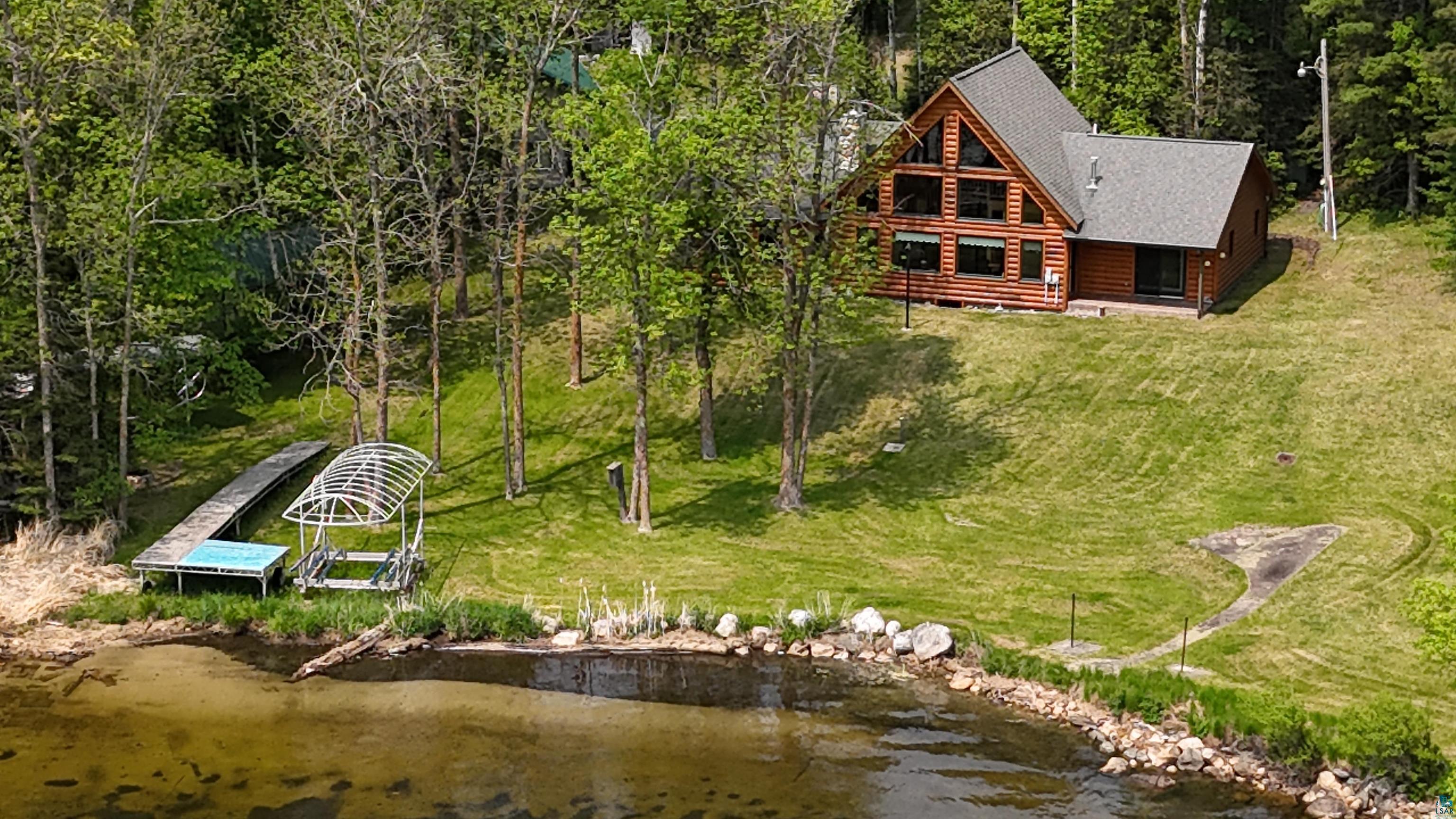 10898 Bessette Road Orr, MN 55771 - Photo 2 of 49 View of subject property with a heavily wooded area