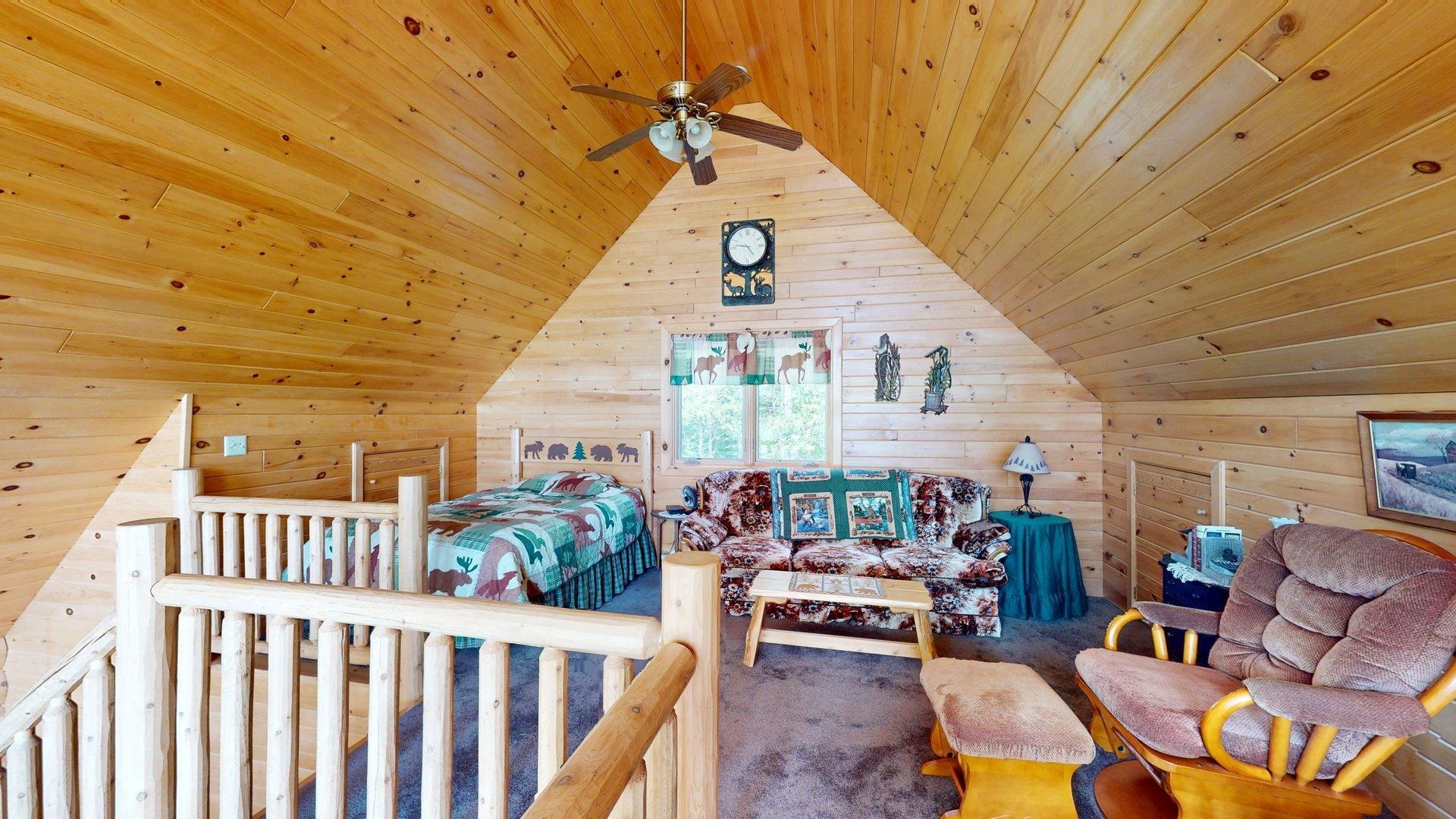 10898 Bessette Road Orr, MN 55771 - Photo 33 of 49 Bedroom featuring wood ceiling, wood walls, vaulted ceiling, and carpet