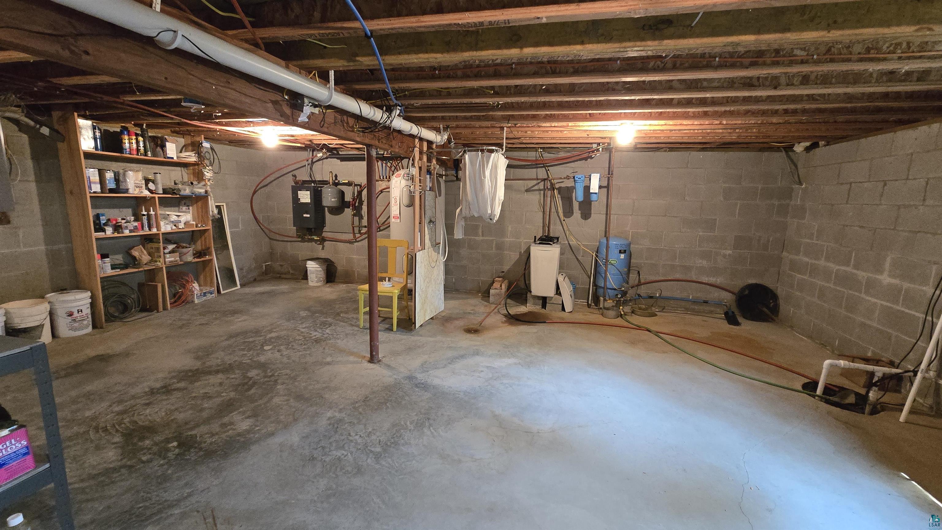 10898 Bessette Road Orr, MN 55771 - Photo 37 of 49 Unfinished below grade area with a water pressure tank