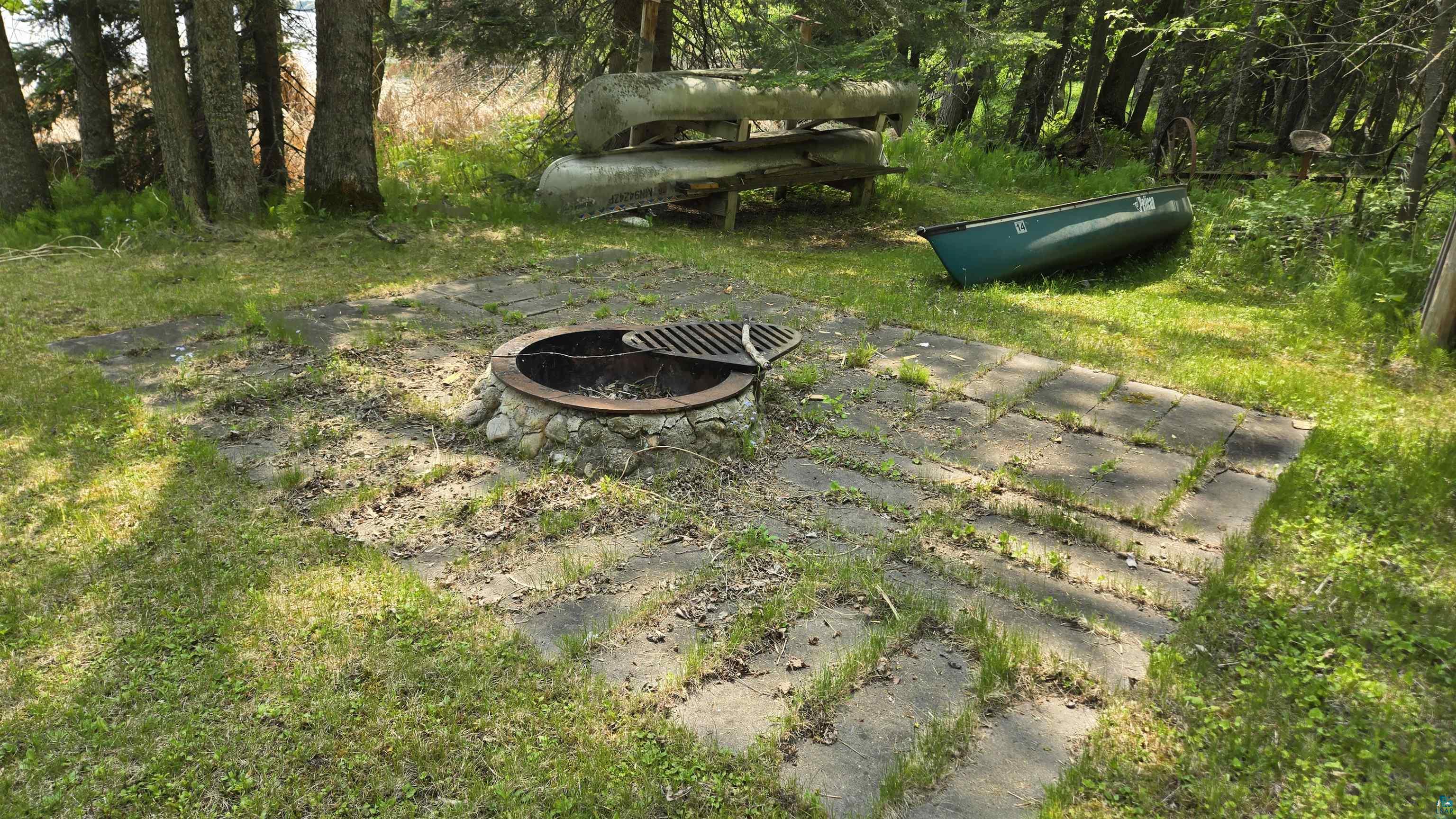 10898 Bessette Road Orr, MN 55771 - Photo 39 of 49 View of yard with an outdoor fire pit
