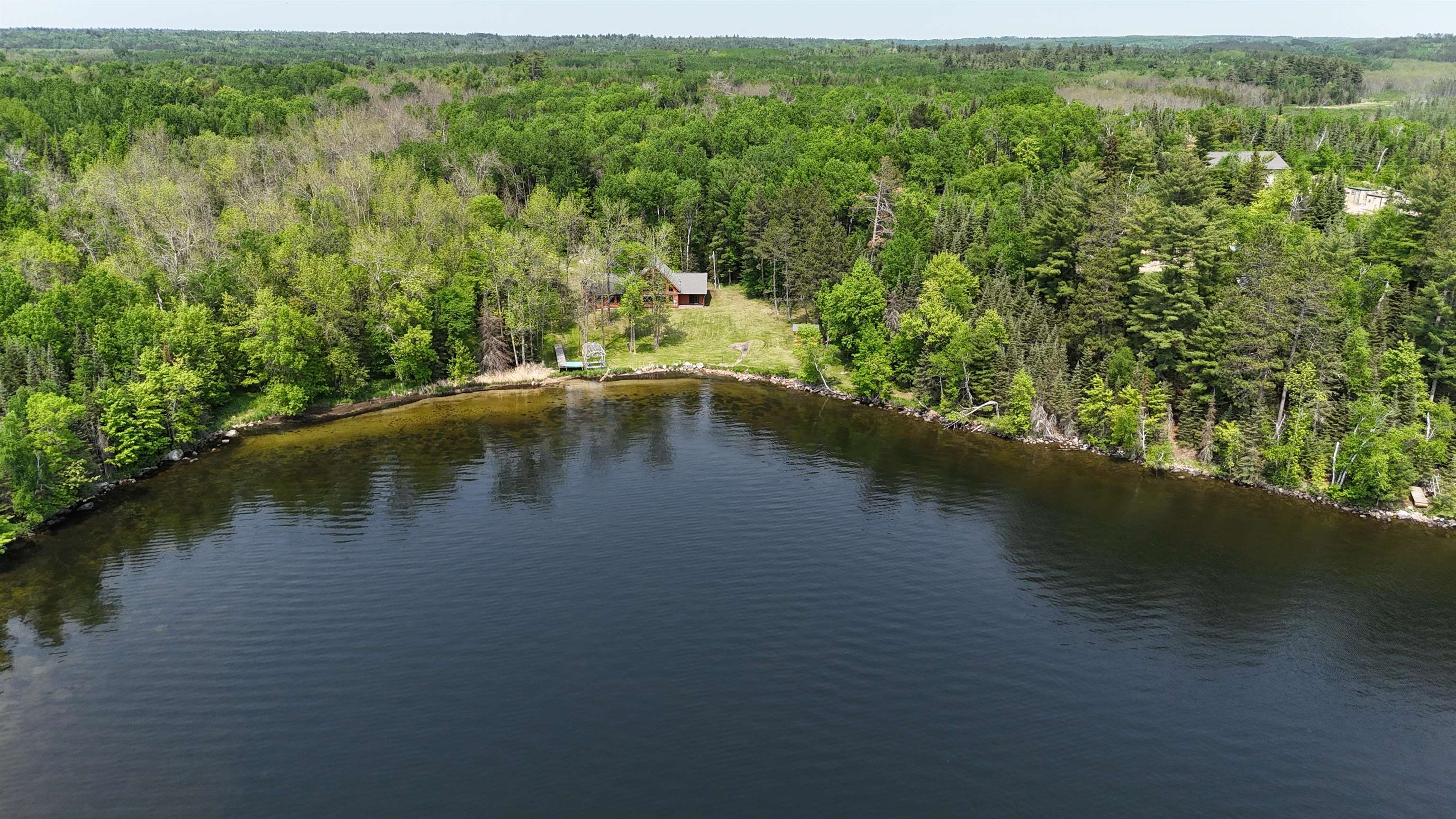 10898 Bessette Road Orr, MN 55771 - Photo 45 of 49 Drone / aerial view of a heavily wooded area and a nearby body of water