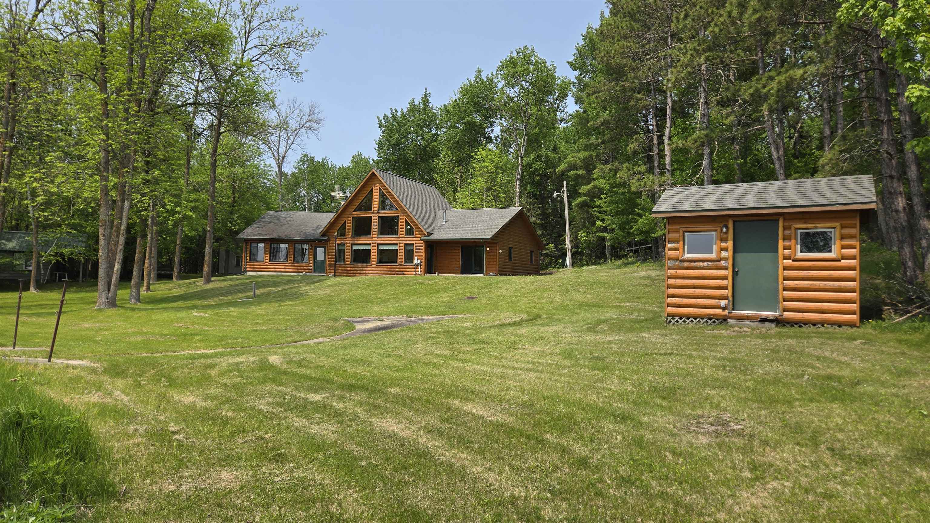 10898 Bessette Road Orr, MN 55771 - Photo 7 of 49 Back of house featuring a lawn