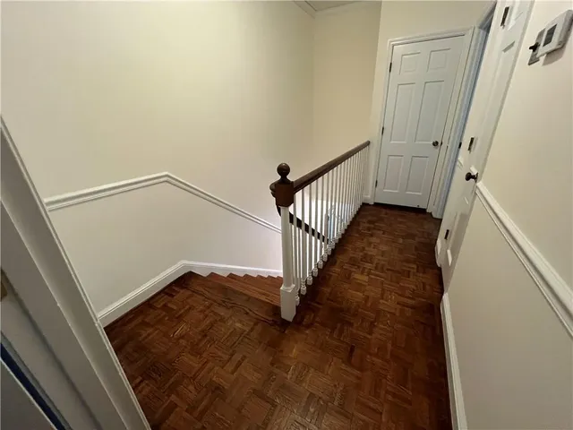 a view of a hallway with staircase