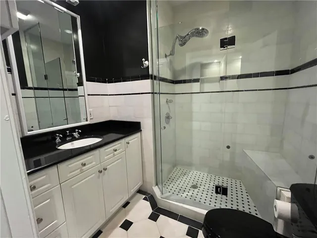 a bathroom with a sink and a shower