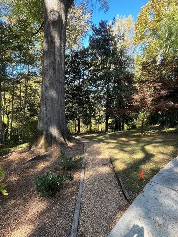 a front view of a house with a yard and a garage