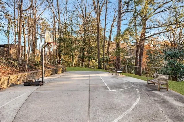 a view of a house with pool and sitting area