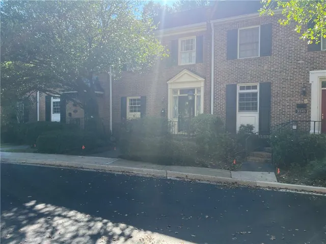 a front view of a house with yard