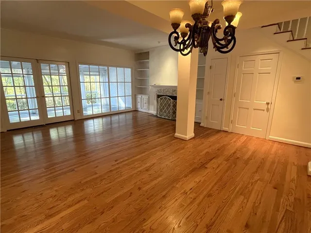 a view of an entryway with wooden floor