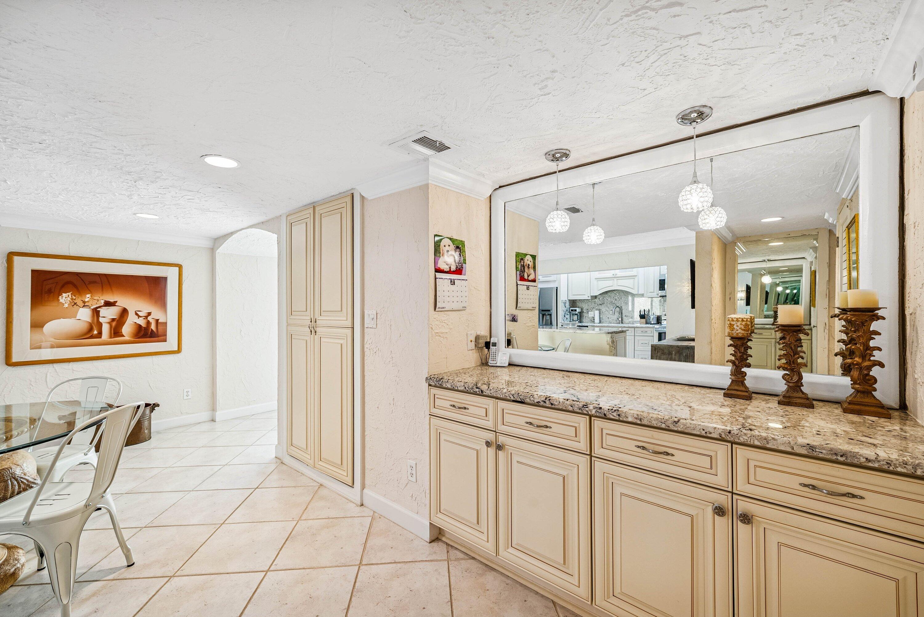 5926 Patio Drive Boca Raton, FL 33433 - Photo 15 of 33 a spacious bathroom with a granite countertop sink mirror and a