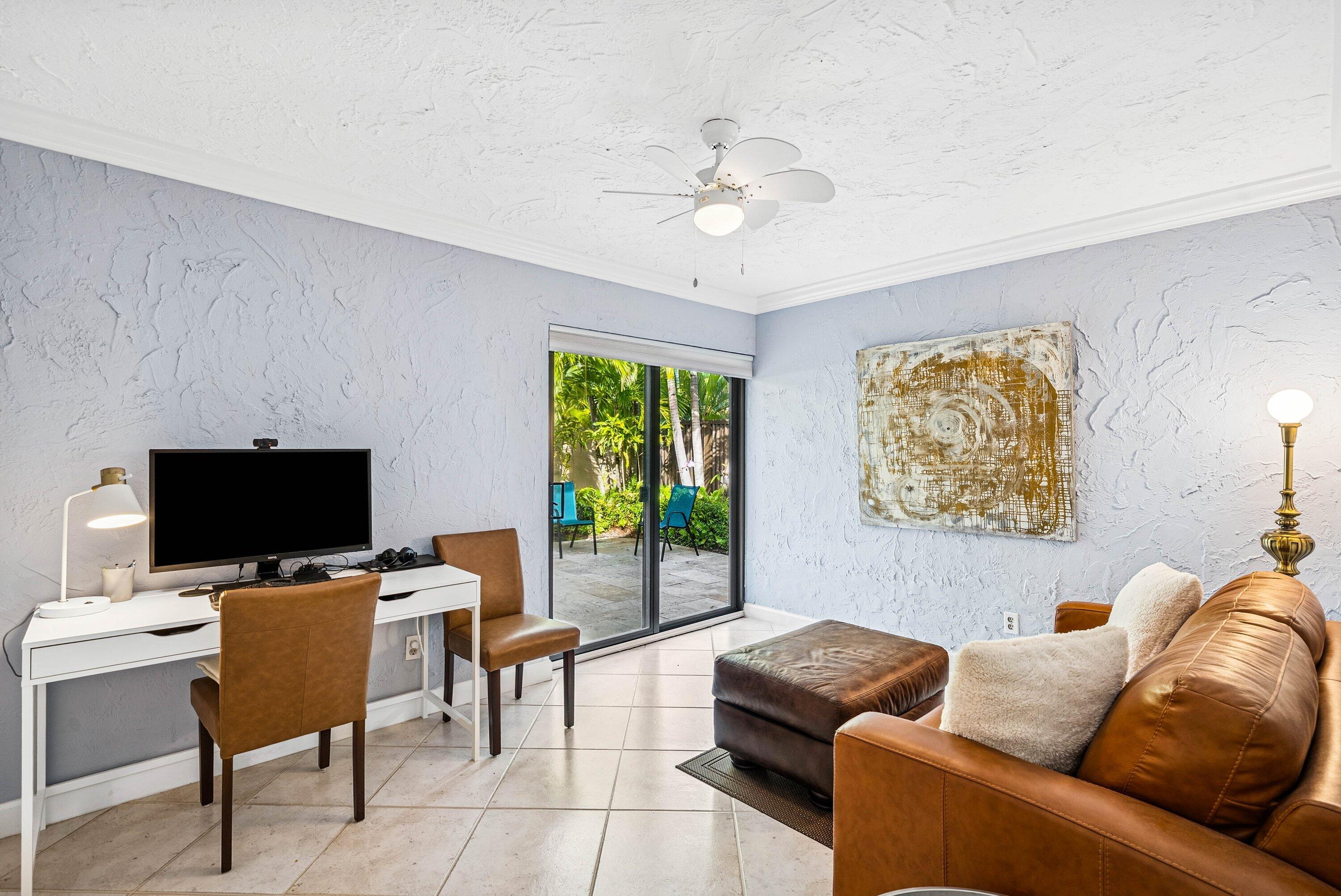 5926 Patio Drive Boca Raton, FL 33433 - Photo 21 of 33 a living room with furniture and a flat screen tv