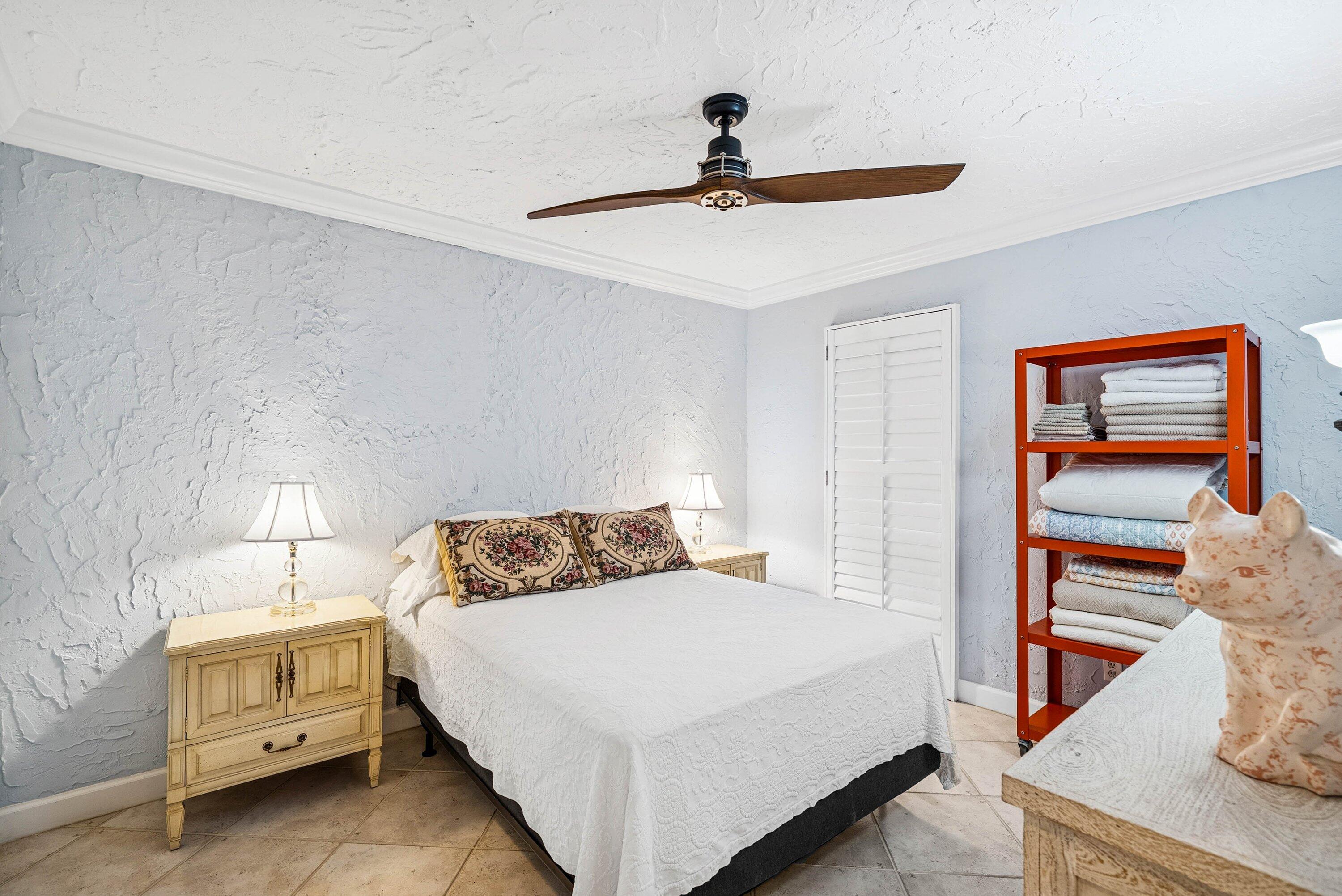 5926 Patio Drive Boca Raton, FL 33433 - Photo 22 of 33 a bedroom with a bed and a chandelier