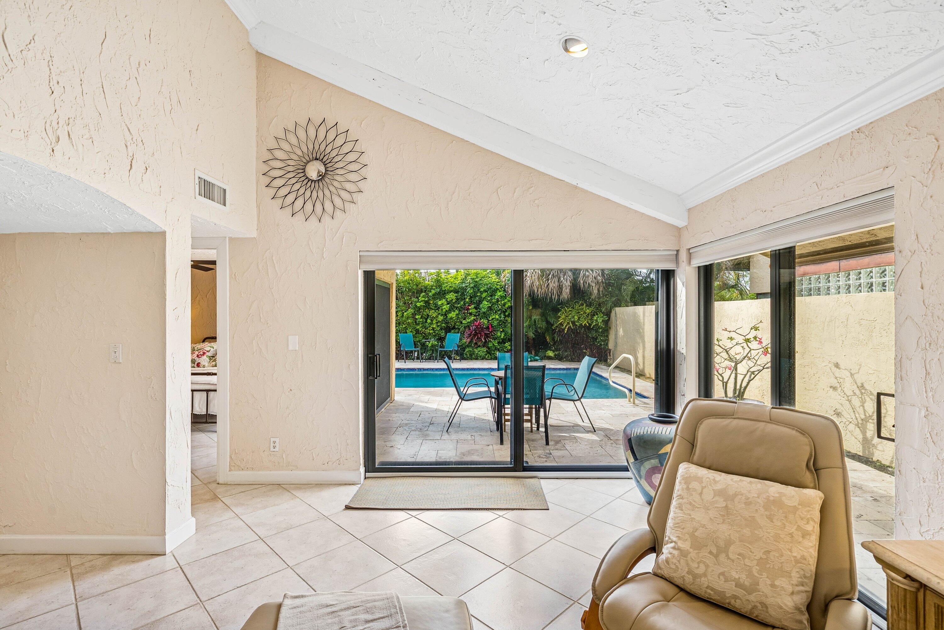 5926 Patio Drive Boca Raton, FL 33433 - Photo 9 of 33 a living room with furniture and a large window
