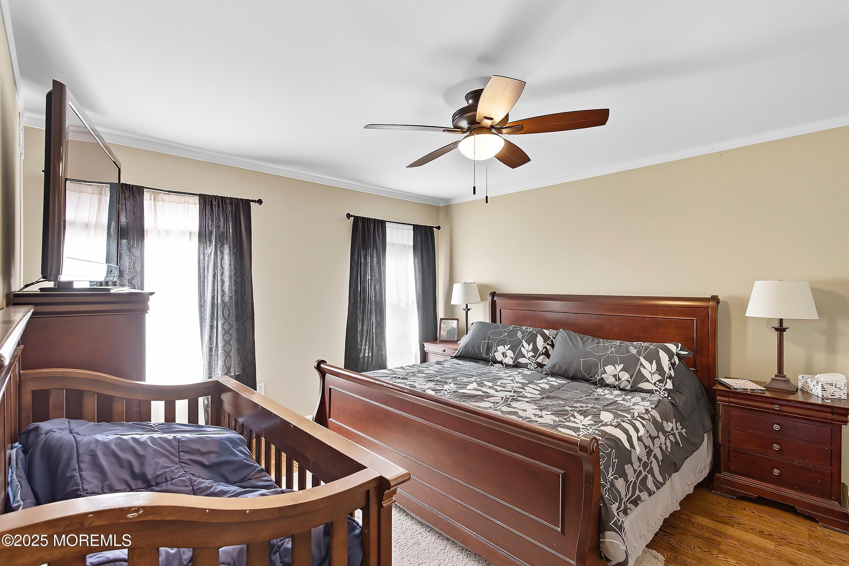 1090 Bennetts Mills Road Jackson, NJ 08527 - Photo 17 of 25 a bed sitting in a bedroom next to a window