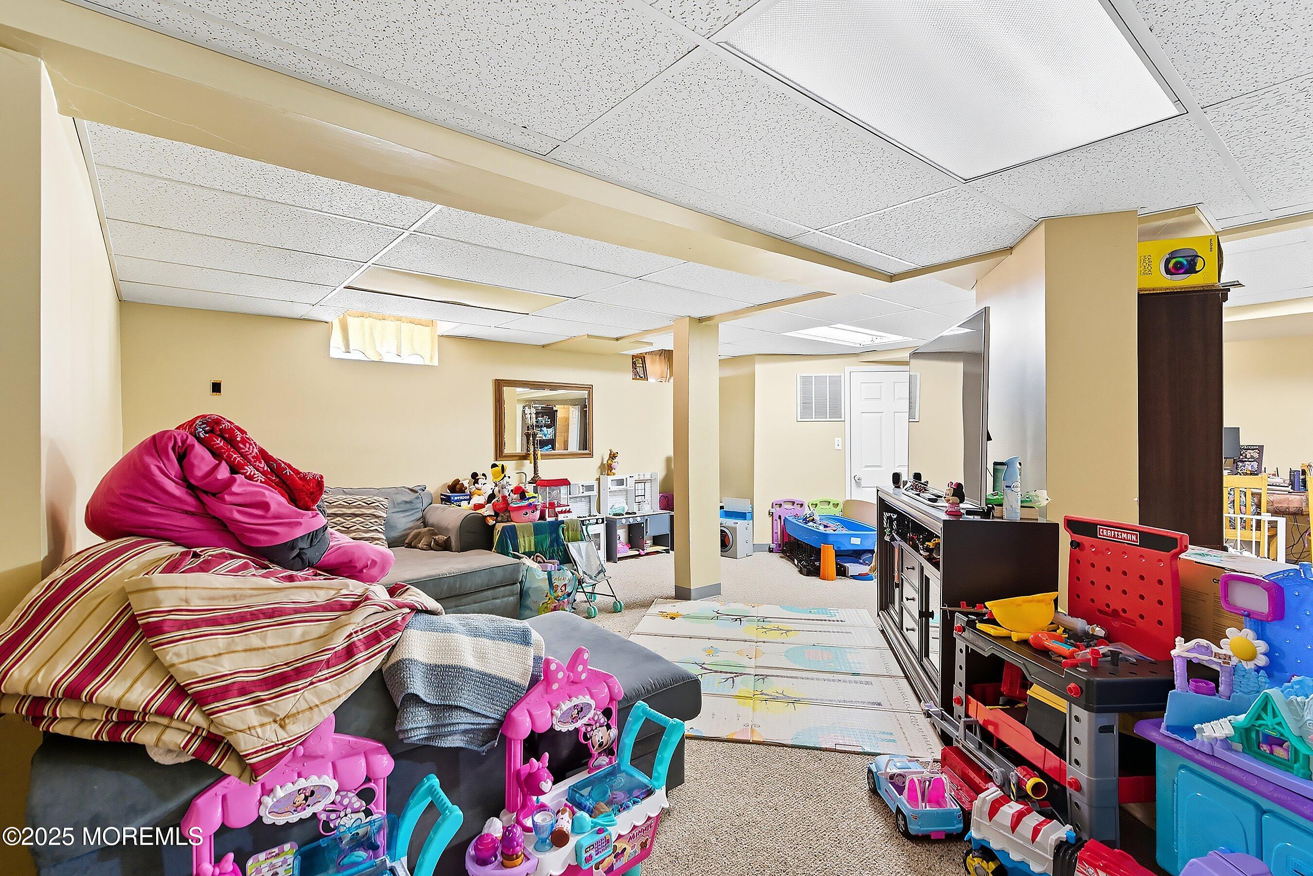 1090 Bennetts Mills Road Jackson, NJ 08527 - Photo 21 of 25 a living room with lots of furniture and couch