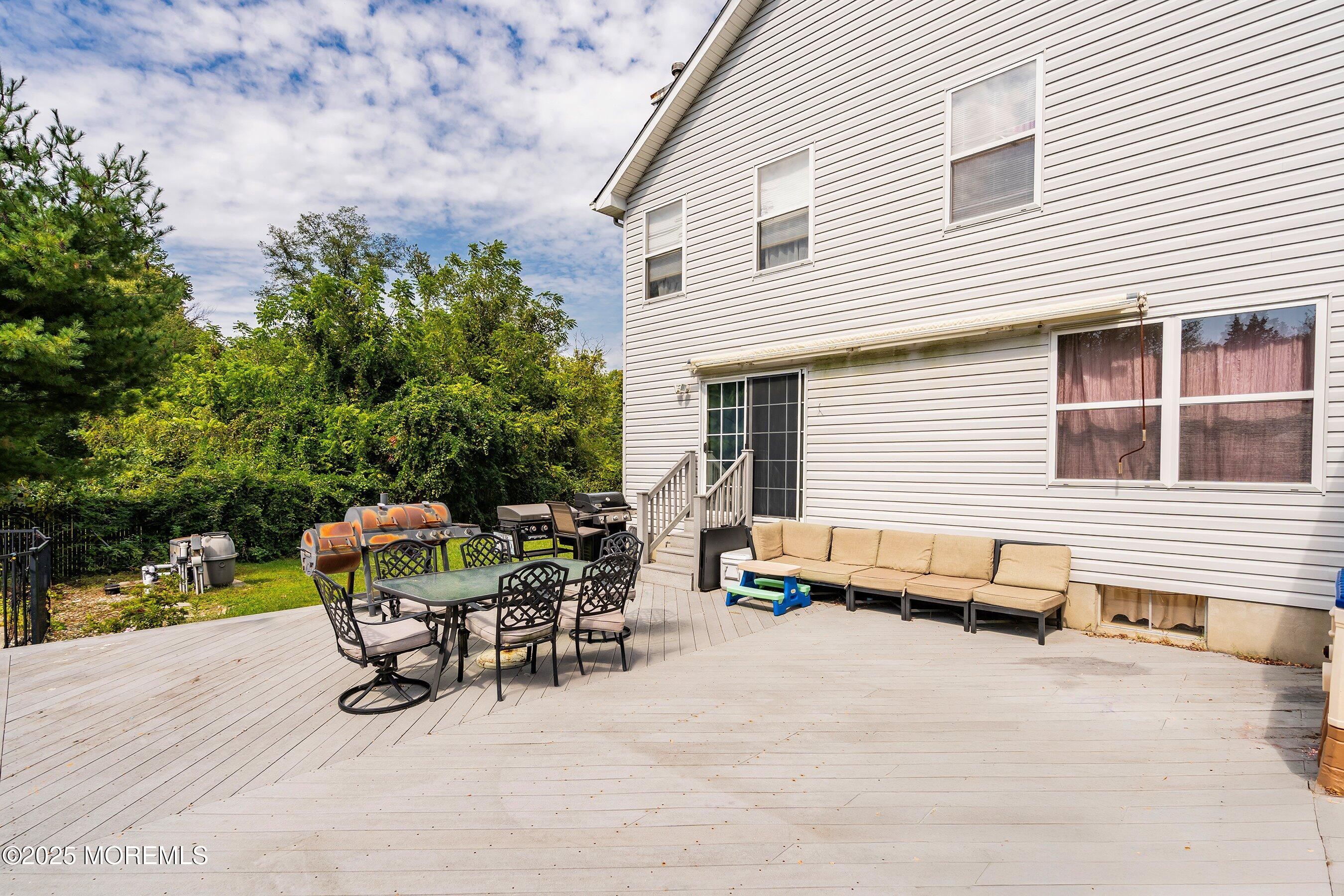 1090 Bennetts Mills Road Jackson, NJ 08527 - Photo 23 of 25 a view of a patio with table and chairs and potted plants