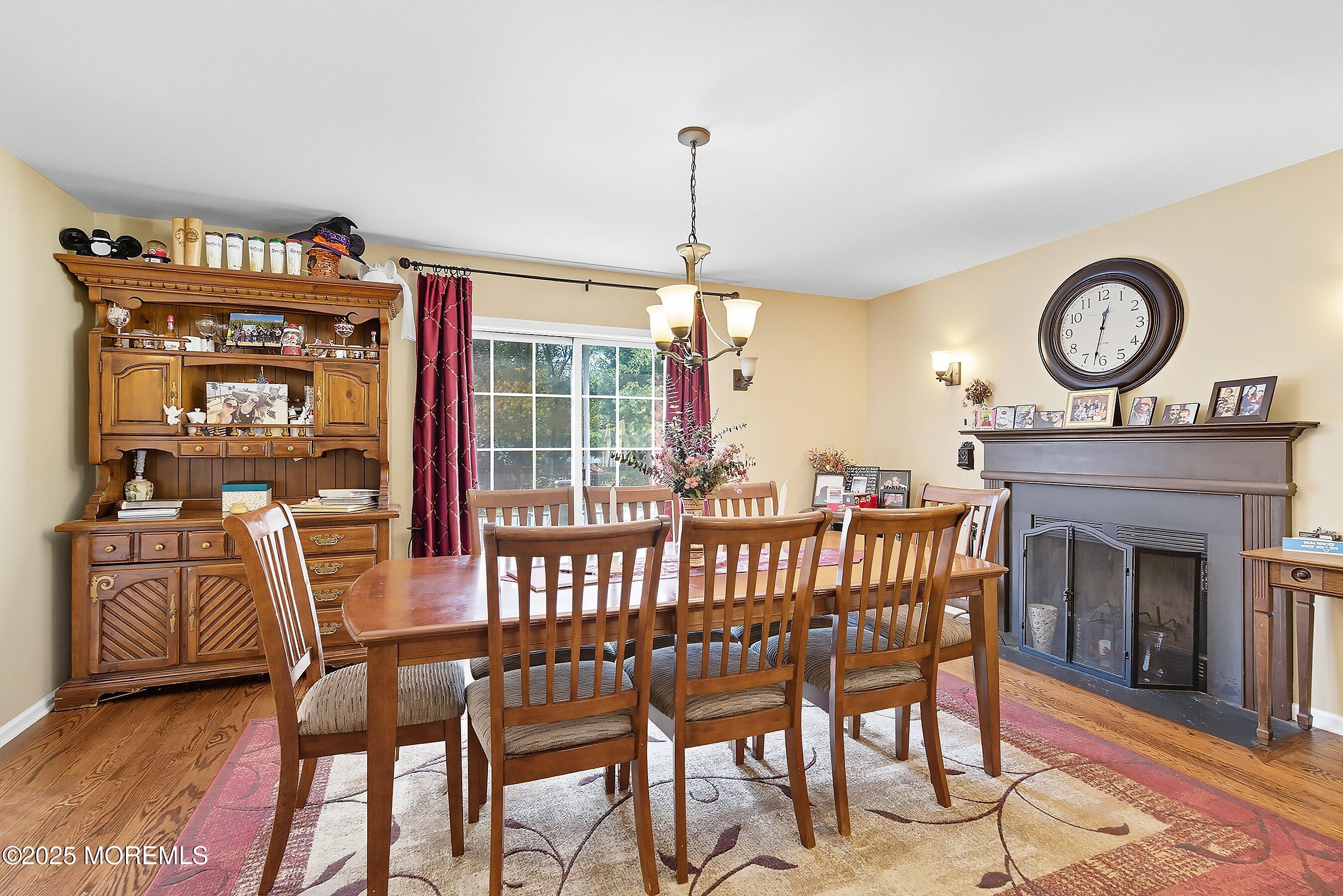1090 Bennetts Mills Road Jackson, NJ 08527 - Photo 6 of 25 a view of a dining room with furniture window and wooden floor