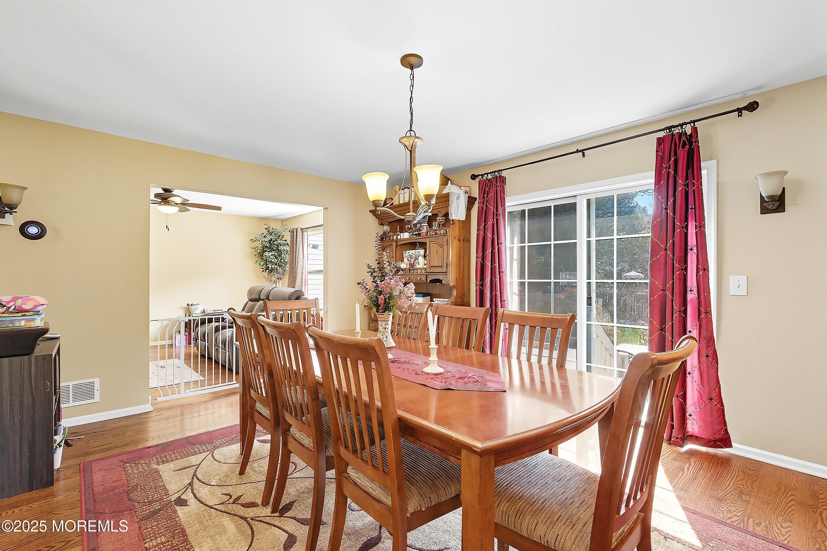 1090 Bennetts Mills Road Jackson, NJ 08527 - Photo 7 of 25 a view of a dining room with furniture and wooden floor