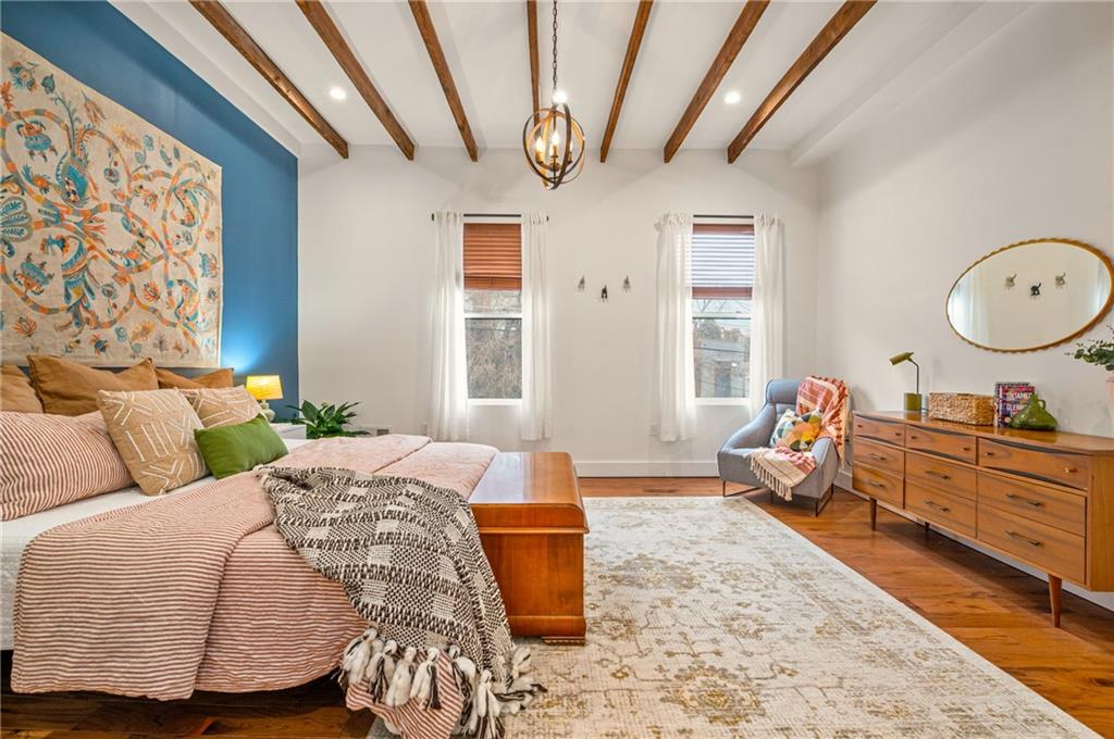 342 Harmar Street Pittsburgh, PA 15219 - Photo 13 of 30 Hardwood floors and 10 foot high ceilings grace the primary suite.