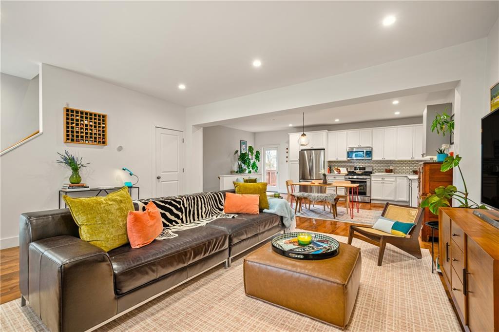 342 Harmar Street Pittsburgh, PA 15219 - Photo 2 of 30 Defined seating area with strong sightlines to the kitchen — modern layout without sacrificing warmth.