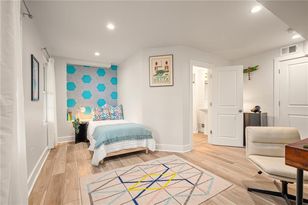 342 Harmar Street Pittsburgh, PA 15219 - Photo 21 of 30 Bright secondary bedroom with modern flooring and thoughtful design details.