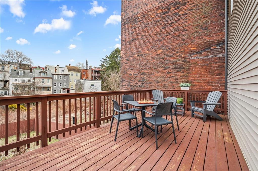 342 Harmar Street Pittsburgh, PA 15219 - Photo 27 of 30 Elevated deck with neighborhood views, morning coffee, late summer dinners, and an easy indoor-outdoor flow from the main level.