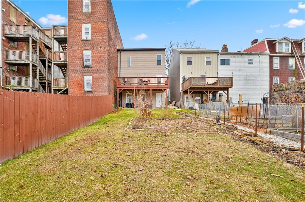 342 Harmar Street Pittsburgh, PA 15219 - Photo 28 of 30 A true backyard not a suggestion of one. Lawn, garden beds, and privacy fencing create a surprisingly generous outdoor footprint.