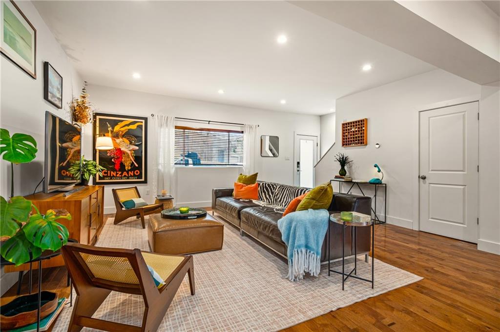 342 Harmar Street Pittsburgh, PA 15219 - Photo 3 of 30 Expansive living space with oversized front window and flexible layout potential. Light moves beautifully from front to back.