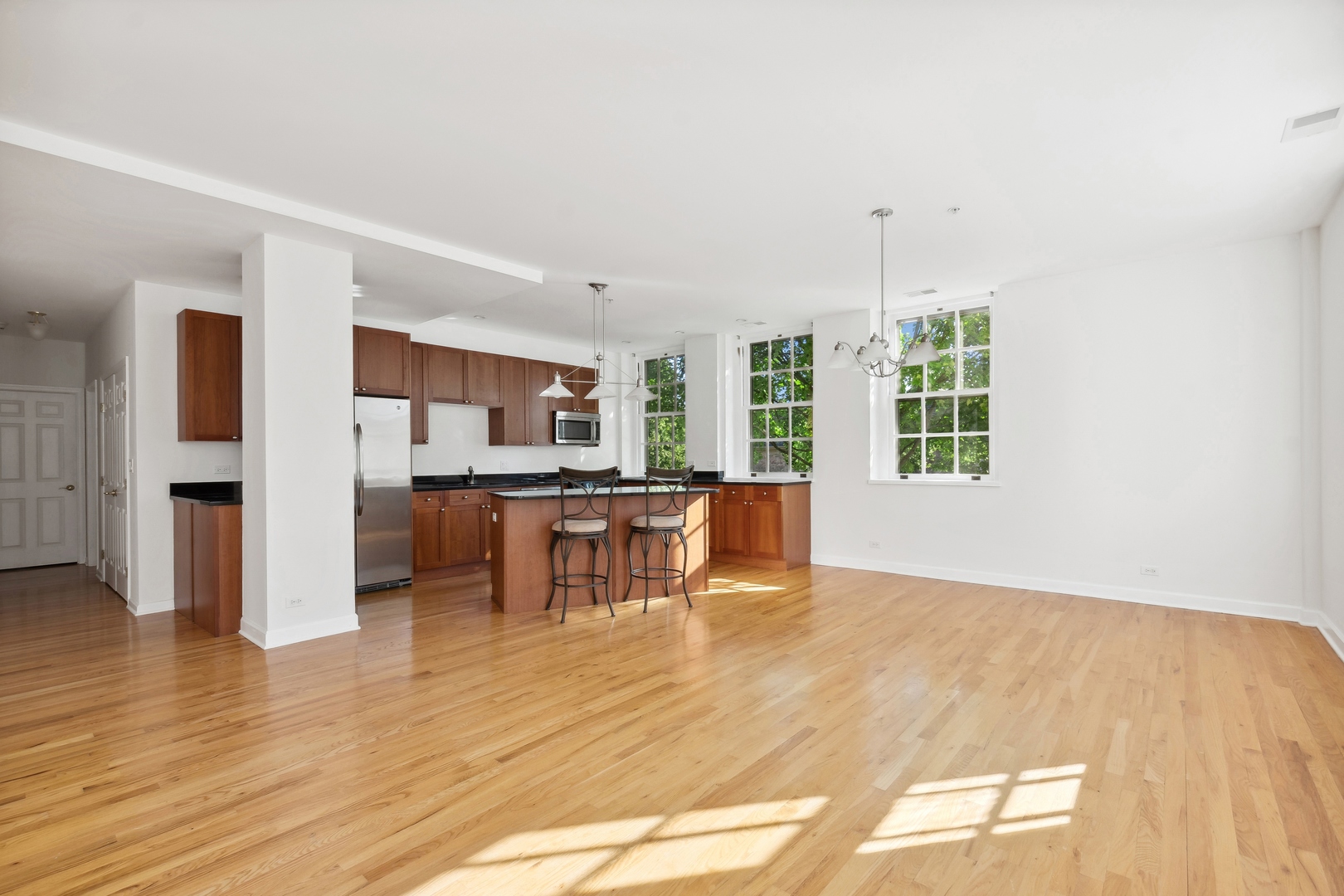 25 Ronan Road, Unit 106 Highwood, IL 60040 - Photo 5 of 14 a view of kitchen with refrigerator and windows