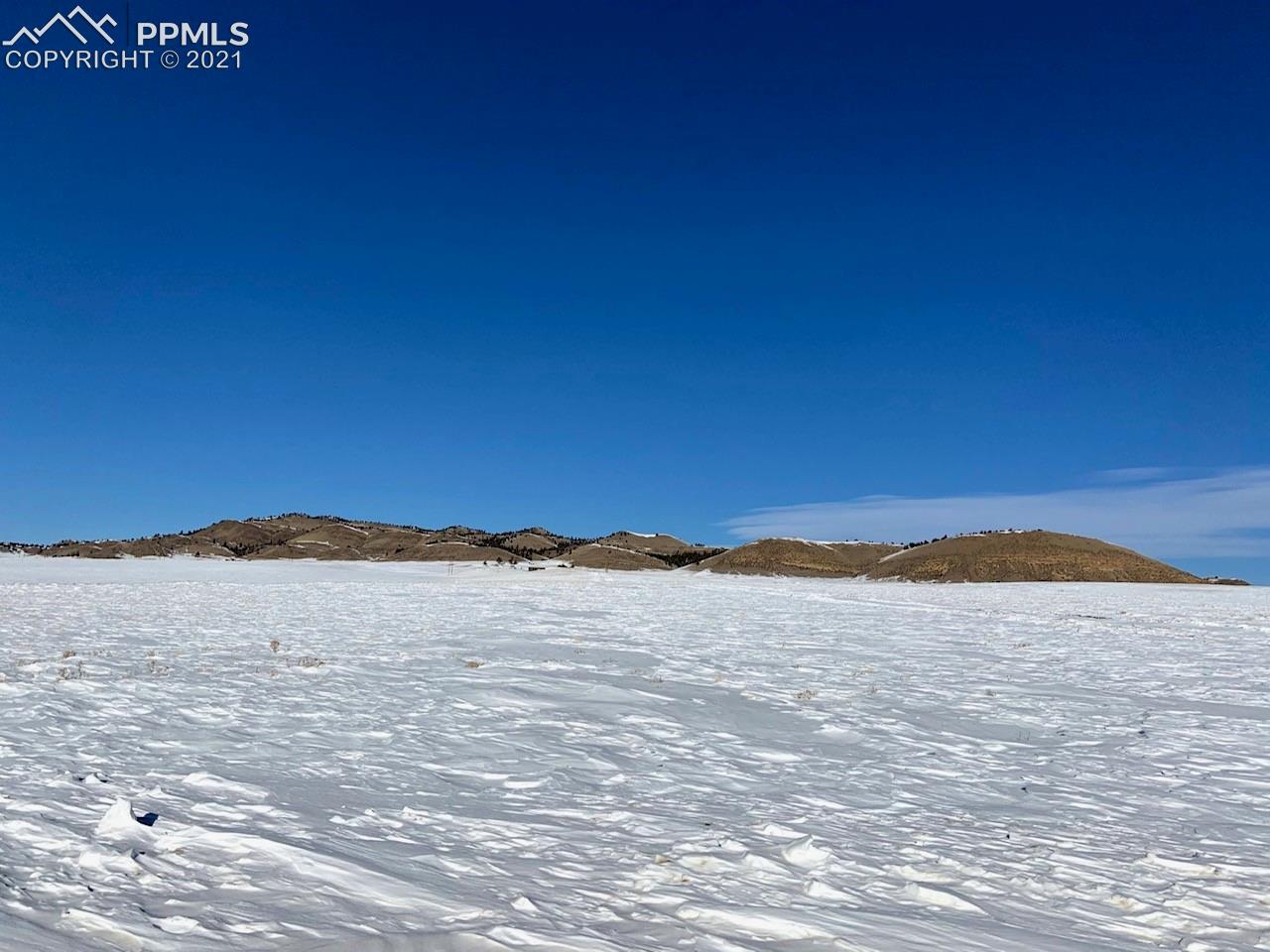 1375 Rio Blanco Road Hartsel, CO 80449 - Photo 9 of 12 Blue sky and hills in the distance.