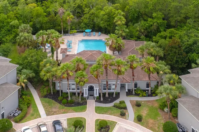 an aerial view of multiple houses with yard