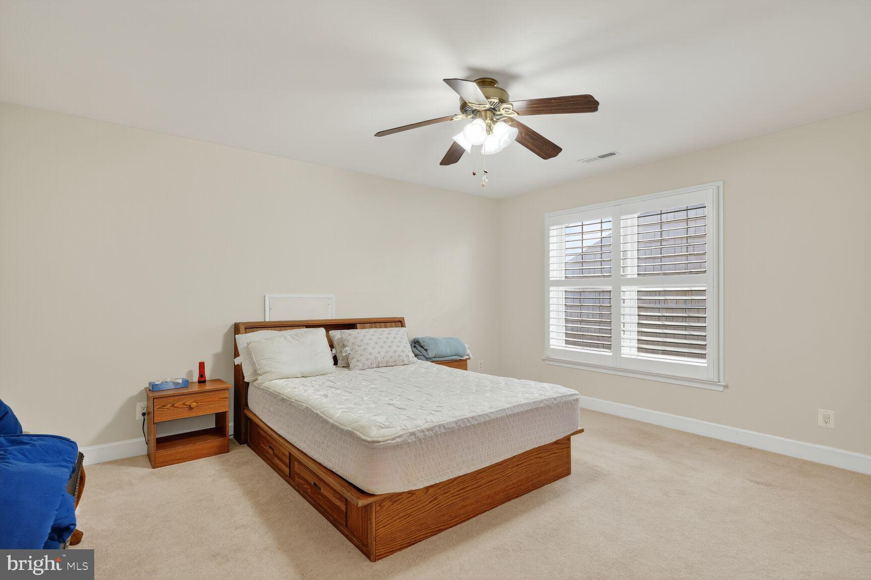 8912 Yellow Daisy Place Lorton, VA 22079 - Photo 15 of 24 a bedroom with a bed and window