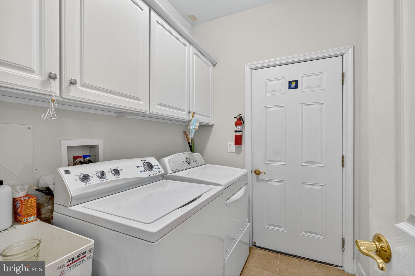 8912 Yellow Daisy Place Lorton, VA 22079 - Photo 17 of 24 a utility room with dryer and washer