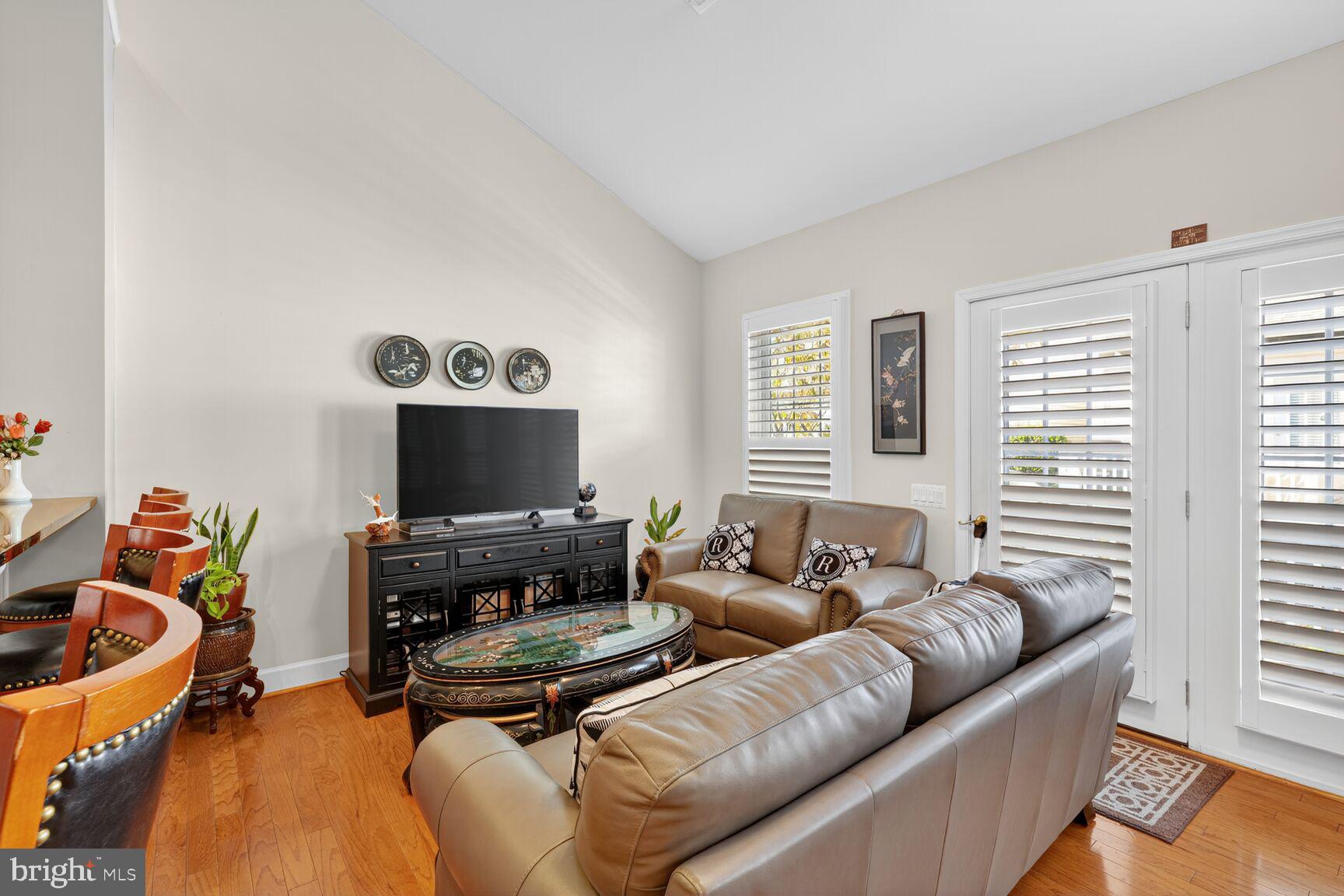 8912 Yellow Daisy Place Lorton, VA 22079 - Photo 19 of 24 a living room with furniture and a flat screen tv