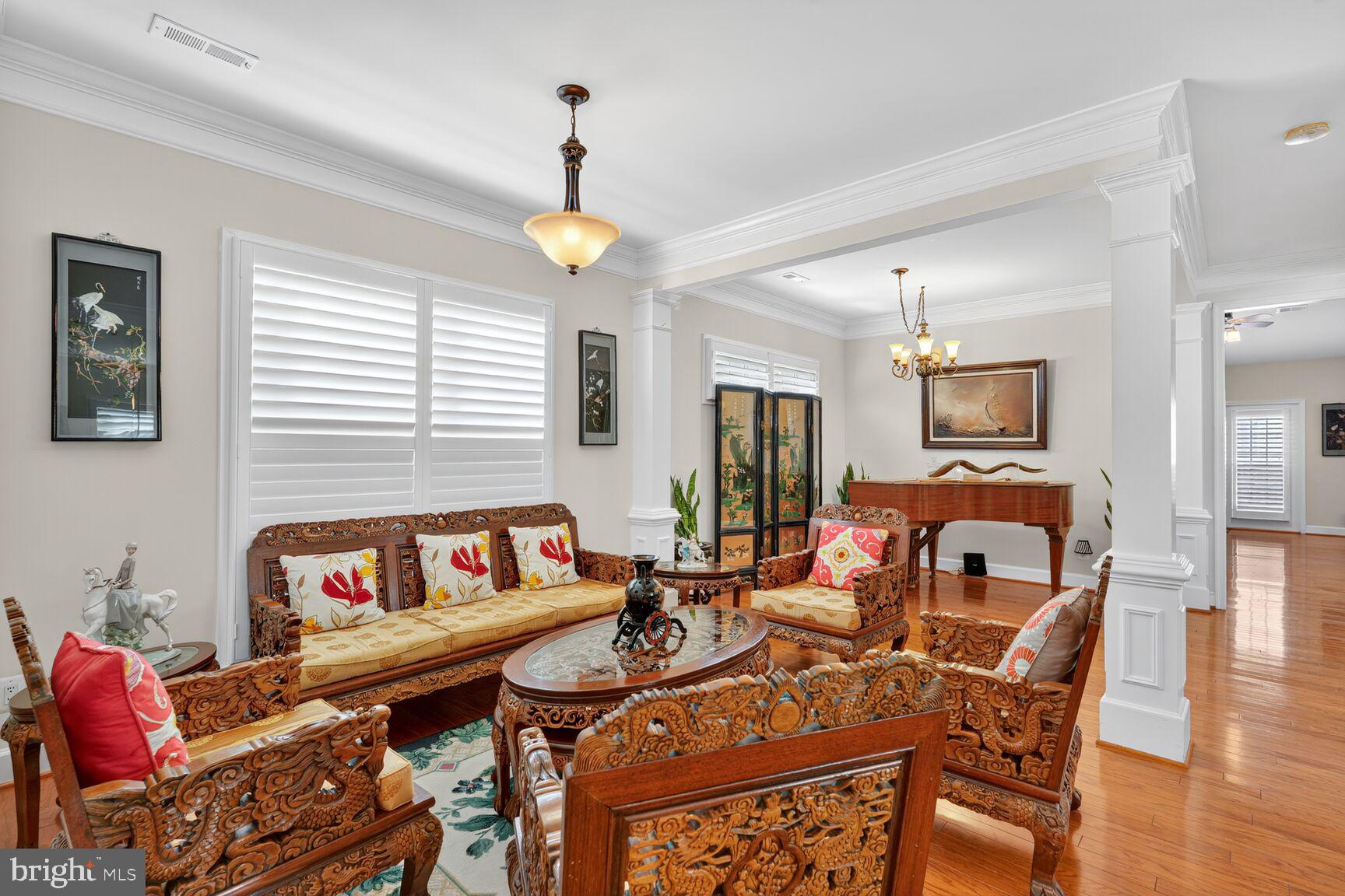 8912 Yellow Daisy Place Lorton, VA 22079 - Photo 2 of 24 a living room with furniture and a flat screen tv
