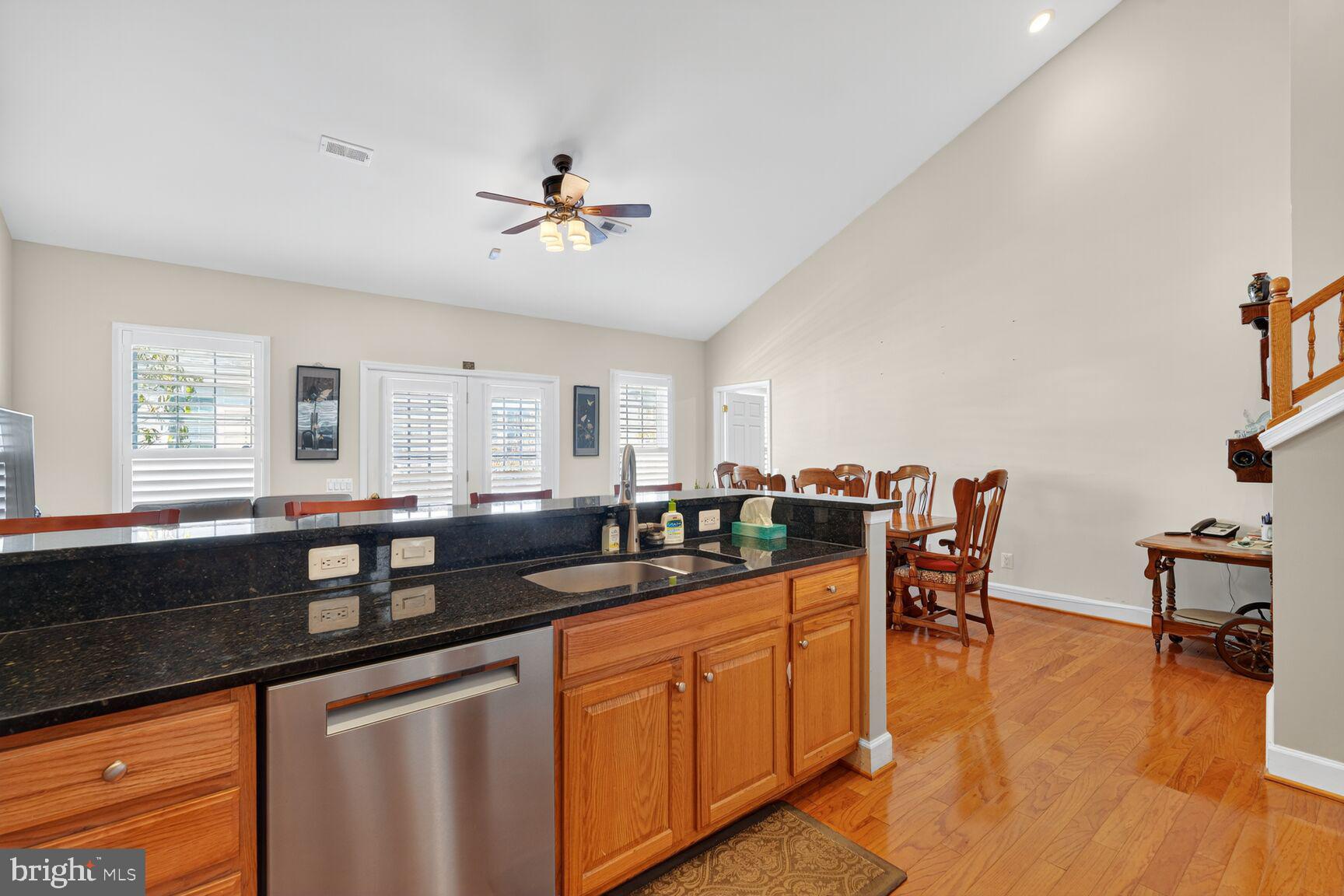 8912 Yellow Daisy Place Lorton, VA 22079 - Photo 4 of 24 a kitchen with granite countertop a sink and cabinets