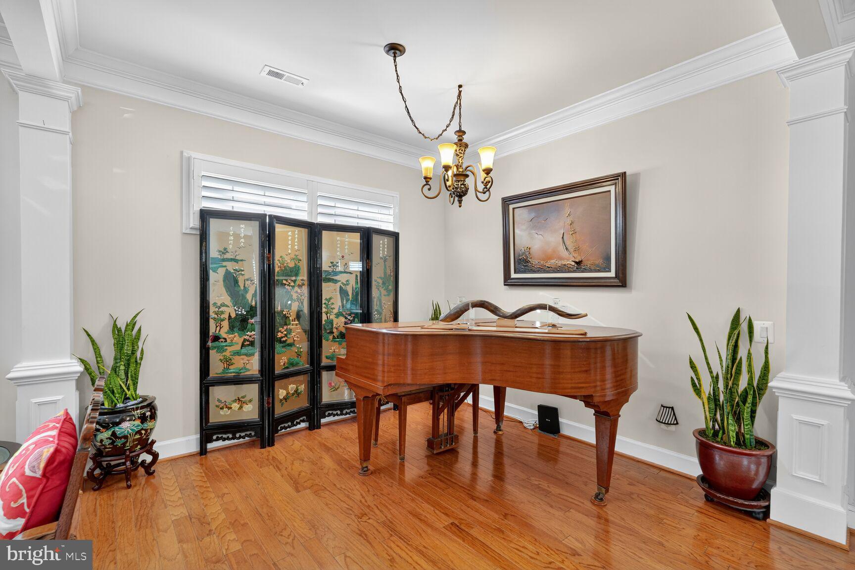 8912 Yellow Daisy Place Lorton, VA 22079 - Photo 6 of 24 a view of a dining room with furniture window and wooden floor