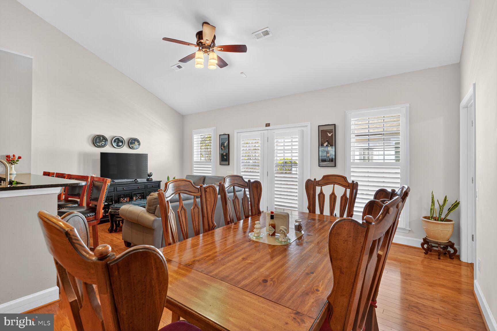 8912 Yellow Daisy Place Lorton, VA 22079 - Photo 8 of 24 a living room with furniture a ceiling fan a fireplace and a window