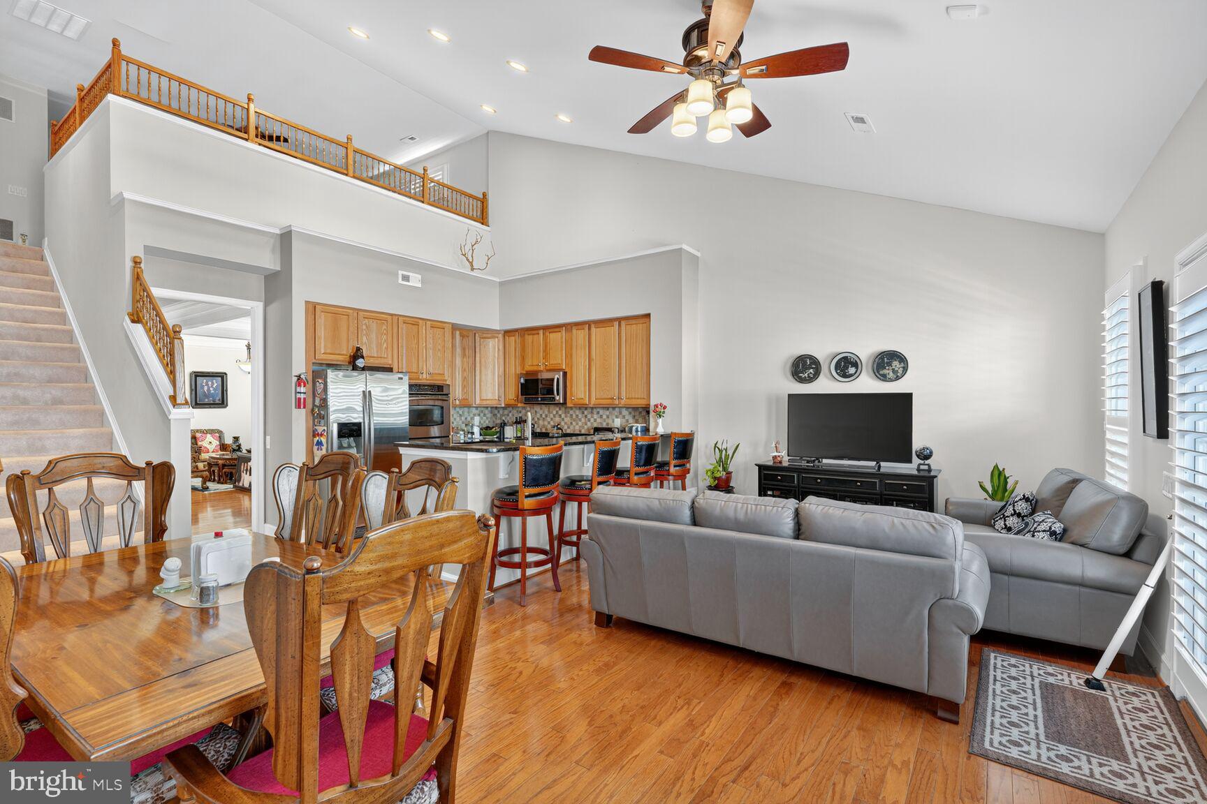 8912 Yellow Daisy Place Lorton, VA 22079 - Photo 9 of 24 a living room with furniture kitchen view and a large window
