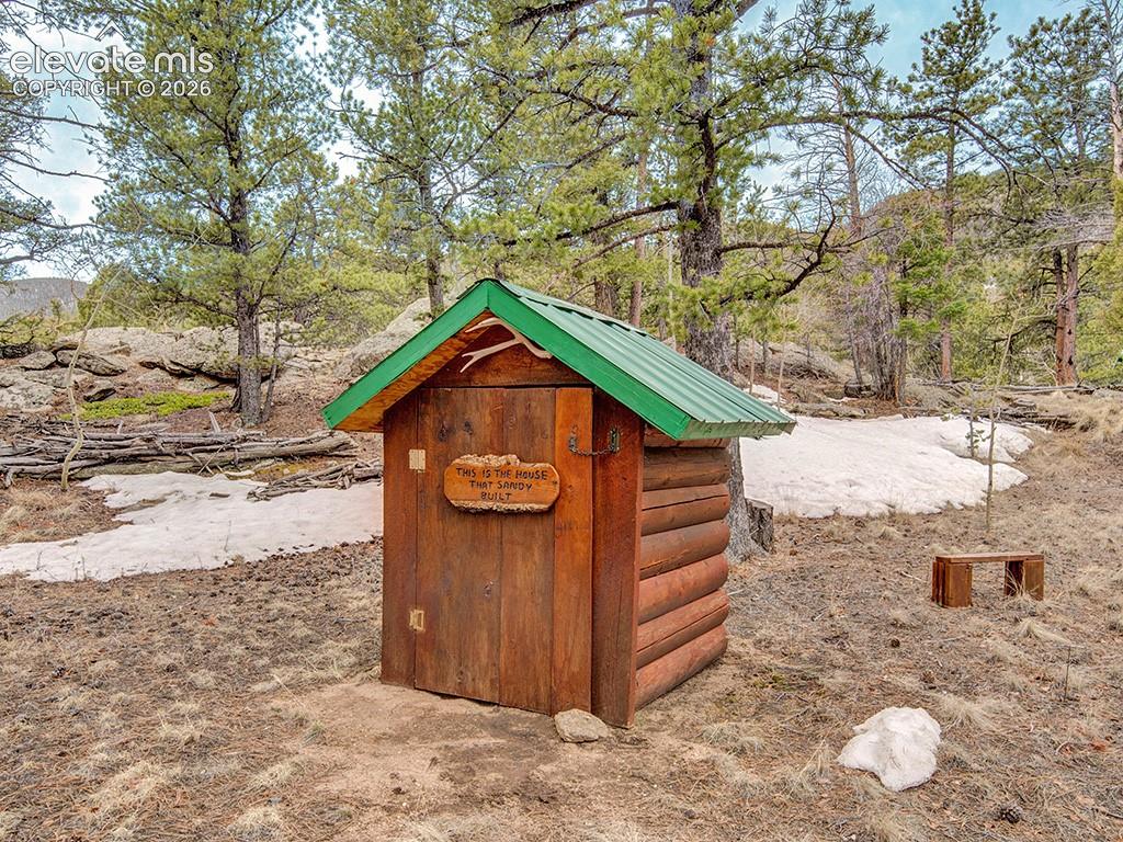 1462 Pulver Road Lake George, CO 80827 - Photo 21 of 25 a front view of a house with a yard covered in snow