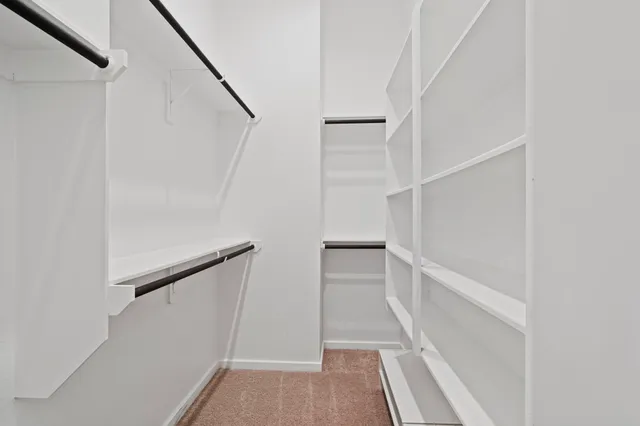 a bathroom with a sink shower and a mirror