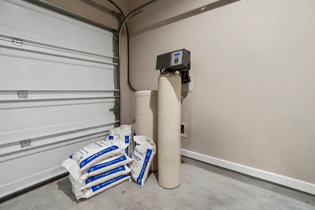 an empty room with closet and windows
