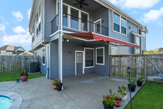 a front view of a building with a garden