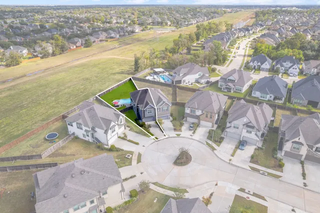 an aerial view of a house with a ocean view