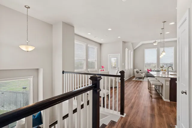 a view of staircase with white walls and a window