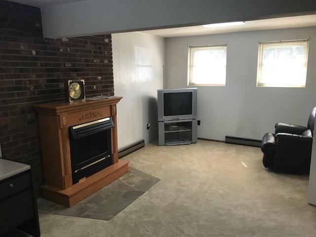 1956 Burma Road Salem, VA 24153 - Photo 15 of 25 a living room with furniture a fireplace and a flat screen tv